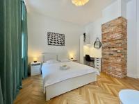 Łóżko lub łóżka w pokoju w obiekcie Chili Apartment