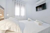 Postel nebo postele na pokoji v ubytování Tejón y Marín, nuevo apartamento en casco antigüo