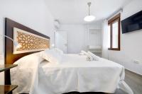 Postel nebo postele na pokoji v ubytování Tejón y Marín, nuevo apartamento en casco antigüo