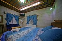 Postel nebo postele na pokoji v ubytování Cappa Cave Hotel