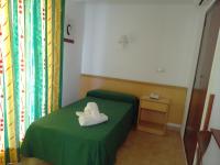 A bed or beds in a room at Hotel Santa Faz