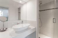 a white bathroom with a sink and a shower at T3 La Tronche Near hospital #A5 in La Tronche