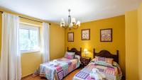 Postel nebo postele na pokoji v ubytování Villa Lagar Martinez Malaga by Ruralidays