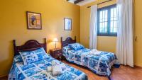 Postel nebo postele na pokoji v ubytování Villa Lagar Martinez Malaga by Ruralidays