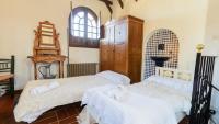Łóżko lub łóżka w pokoju w obiekcie Casa El Rosario Ronda by Ruralidays