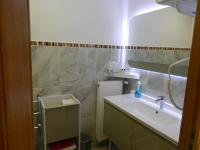 a bathroom with a sink and a mirror at Hôtel Les Charmilles de Mormal in Landrecies