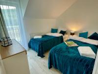 Łóżko lub łóżka w pokoju w obiekcie Apartament Jak Marzenie