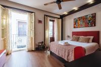 A bed or beds in a room at Divi Apartments Villa Reyes 2