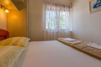 Postel nebo postele na pokoji v ubytování One-Bedroom Apartment in Crikvenica 8