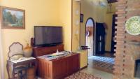 Televízia a/alebo spoločenská miestnosť v ubytovaní La Casa Del Duca