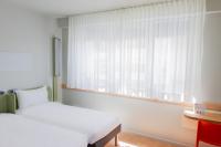 Cama o camas de una habitación en Ibis Budget Braga Centro