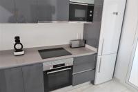 A kitchen or kitchenette at Flamenca Village Penthouse