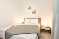 Posteľ alebo postele v izbe v ubytovaní Apartments Doris, Krk