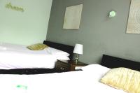 Henson Hotel Pleasure Beachにあるベッド