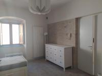 A bed or beds in a room at Affittacamere La Torre