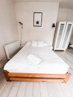 Posteľ alebo postele v izbe v ubytovaní Apartament Kraków Arena