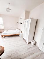 Posteľ alebo postele v izbe v ubytovaní Apartament Kraków Arena
