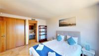 A bed or beds in a room at Lomas de los Monteros - Apartment with seaviews
