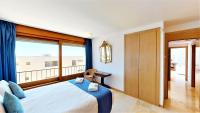 A bed or beds in a room at Lomas de los Monteros - Apartment with seaviews