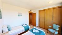 A bed or beds in a room at Lomas de los Monteros - Apartment with seaviews