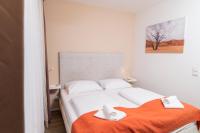 Posteľ alebo postele v izbe v ubytovaní Apartments Favoriten
