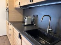 Kuchyň nebo kuchyňský kout v ubytování Apartmán u jezera Lipno - Nové