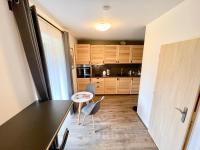 Kuchyň nebo kuchyňský kout v ubytování Apartmán u jezera Lipno - Nové