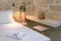 Postel nebo postele na pokoji v ubytování Inotropes Boutique Suites - Adults Only