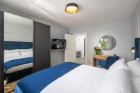 Posteľ alebo postele v izbe v ubytovaní Blue Allure Apartment