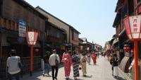 a group of people walking down a street at Kyoto Inn Gion The Second in Kyoto