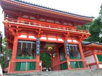 a red building with a balcony in front of it at Kyoto Inn Gion The Second in Kyoto