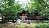 a garden with rocks in front of a building at Kyoto Inn Gion The Second in Kyoto