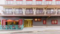 a building with red doors and a balcony at Kyoto Inn Gion The Second in Kyoto