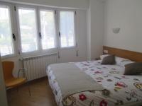 Posteľ alebo postele v izbe v ubytovaní Apartamentos Grosen