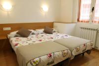 Posteľ alebo postele v izbe v ubytovaní Apartamentos Grosen