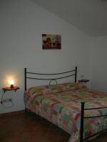 Łóżko lub łóżka w pokoju w obiekcie Casa Vacanze Fortini