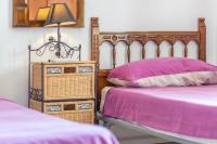 Postel nebo postele na pokoji v ubytování Villa Margarita
