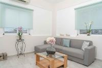 A seating area at Tzortzi's Family Apartments