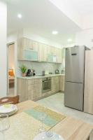 A kitchen or kitchenette at Tzortzi's Family Apartments