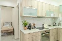 A kitchen or kitchenette at Tzortzi's Family Apartments