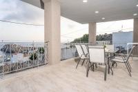 A balcony or terrace at Tzortzi's Family Apartments