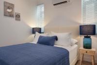 A bed or beds in a room at Ada Dreams City