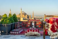 a balcony with colorful furniture and a view of the mosque at World Heritage Center Hotel in Istanbul