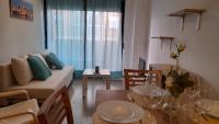 Posezení v ubytování Piso Casa Reina Un lugar cerca del mar y el puerto