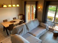 a living room with a couch and a table at Casita Planes Surroca in Bourg-Madame