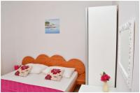 Postel nebo postele na pokoji v ubytování Apartments Luciano