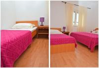 Postel nebo postele na pokoji v ubytování Apartments Luciano