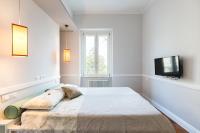 A bed or beds in a room at Guest House Poerio88