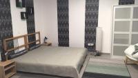 Łóżko lub łóżka w pokoju w obiekcie Cuki Apartmanok