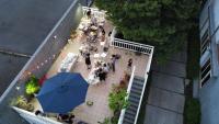 an overhead view of a crowd of people sitting at a restaurant at I Leisure B&amp;B in Yuanshan